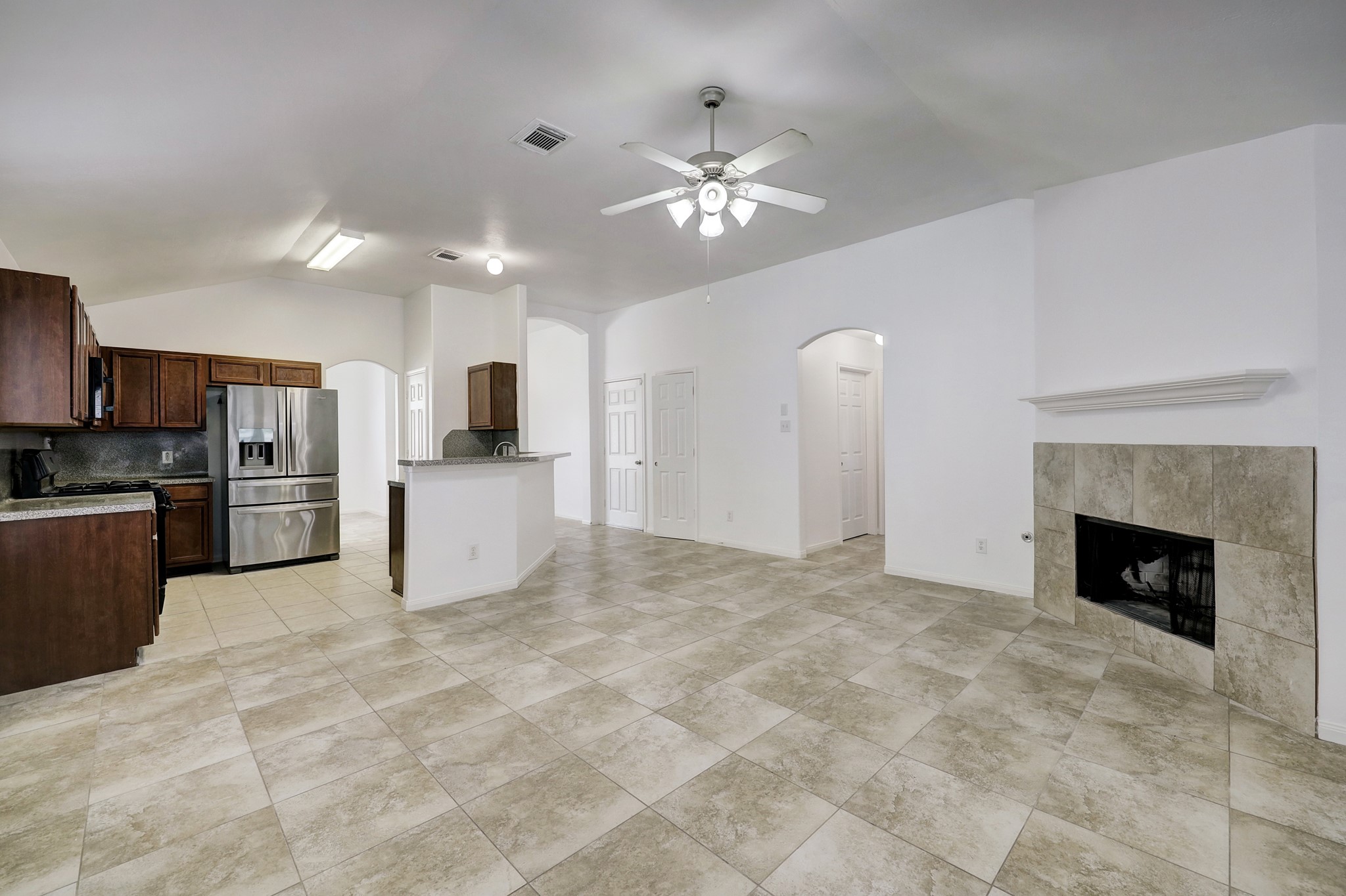 25407 Clover Ranch Drive Katy, TX 77494 - Photo 7 of 17 View of the living room that opens up from the kitchen and fireplace