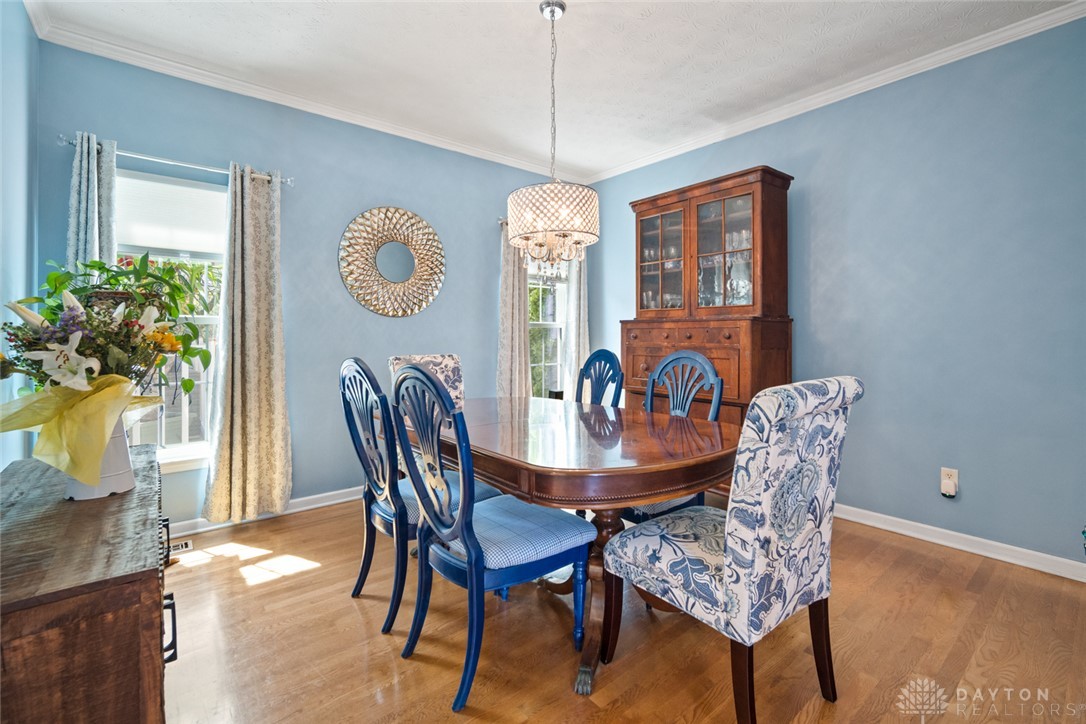 55 Janney Lane Springboro, OH 45066 - Photo 19 of 38 This bright dining room features a warm hardwood floor and elegant crown molding.