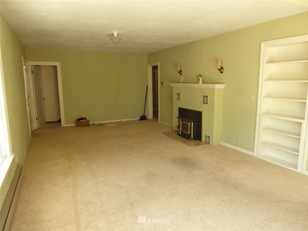 611 Logan Hill Road Chehalis, WA 98532 - Photo 14 of 25 a view of an empty room with a fireplace