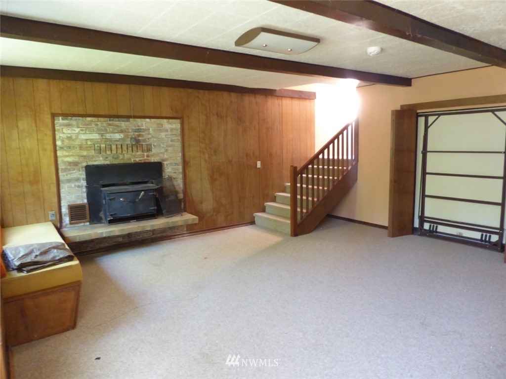 611 Logan Hill Road Chehalis, WA 98532 - Photo 20 of 25 a view of a livingroom with furniture and a fireplace