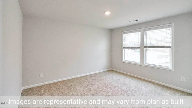 a bathroom with a tub a sink and a large mirror