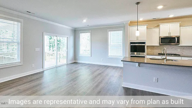 a view of kitchen with wooden floor