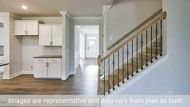 a view interior of kitchen and hall with wooden floor