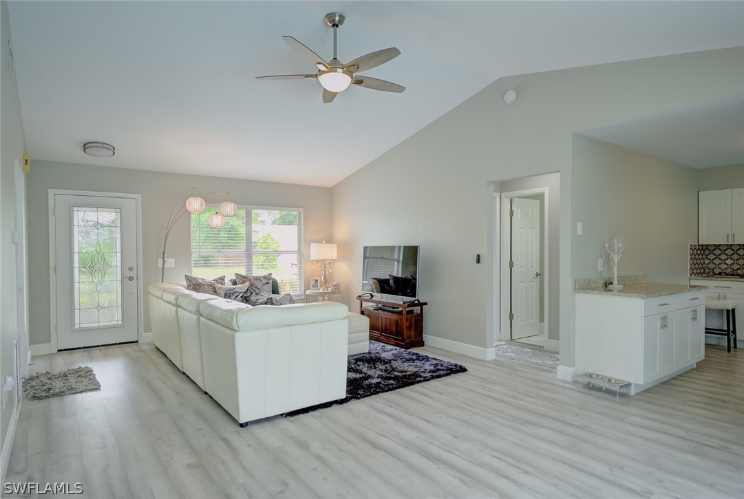 17388 Ingram Road Fort Myers, FL 33967 - Photo 2 of 18 a living room with furniture and a flat screen tv