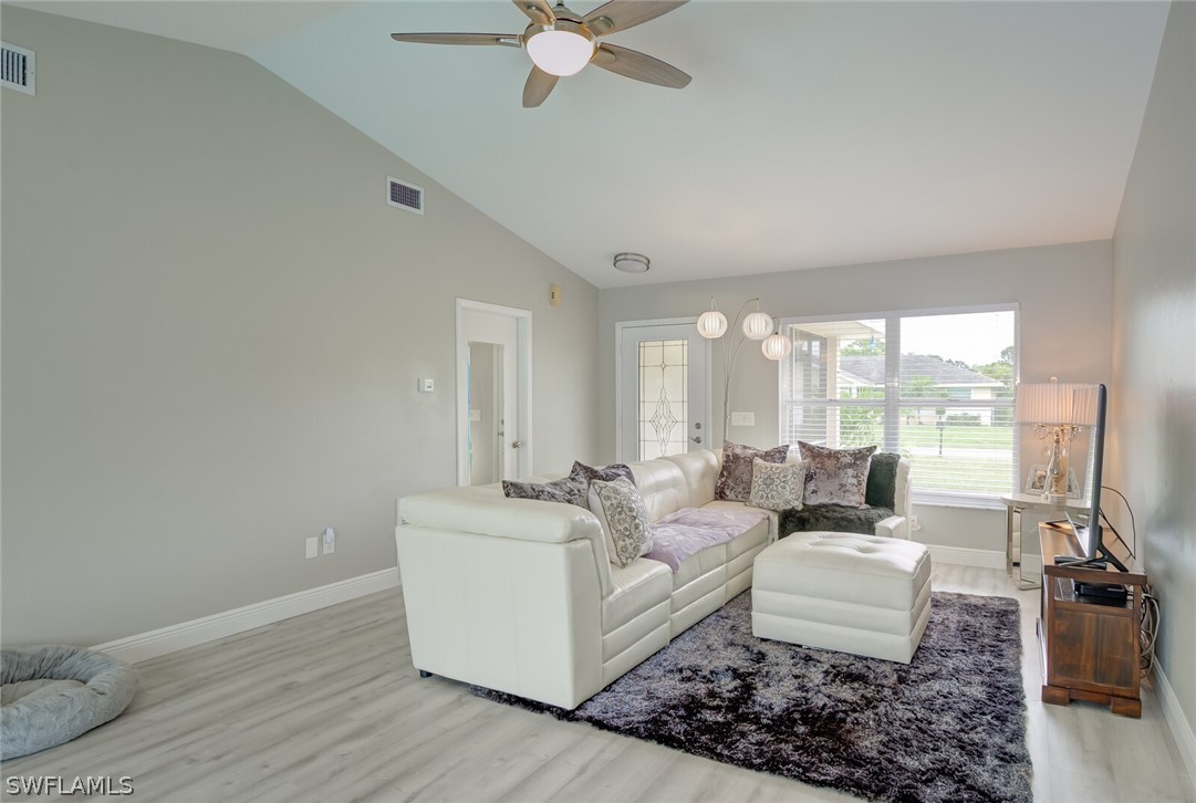 17388 Ingram Road Fort Myers, FL 33967 - Photo 3 of 18 a living room with furniture and a large window