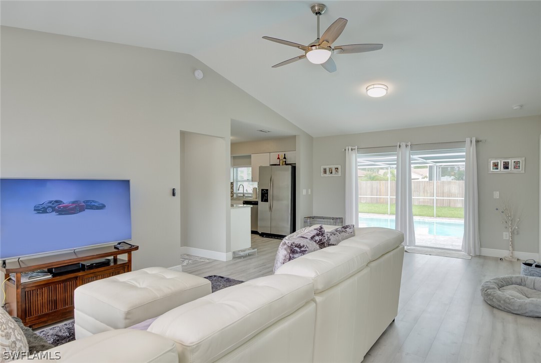 17388 Ingram Road Fort Myers, FL 33967 - Photo 4 of 18 a living room with furniture and a flat screen tv