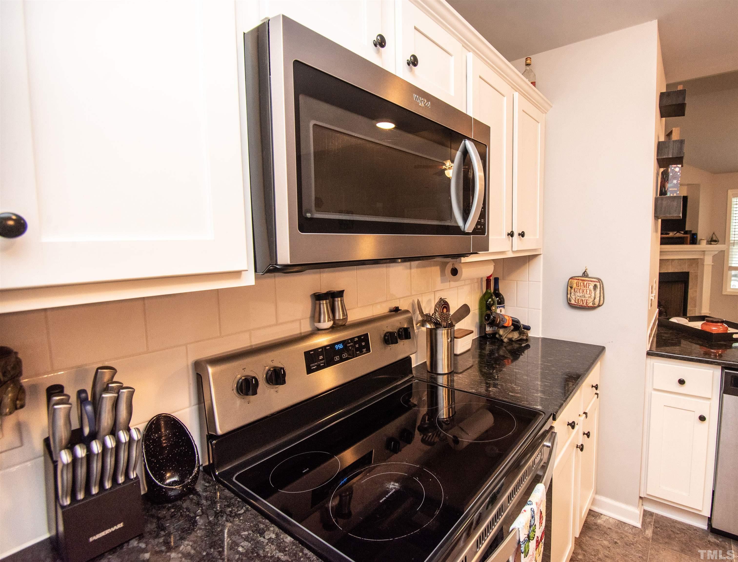 113 Cornfield Lane Benson, NC 27504 - Photo 13 of 13 a kitchen with a stove and a microwave