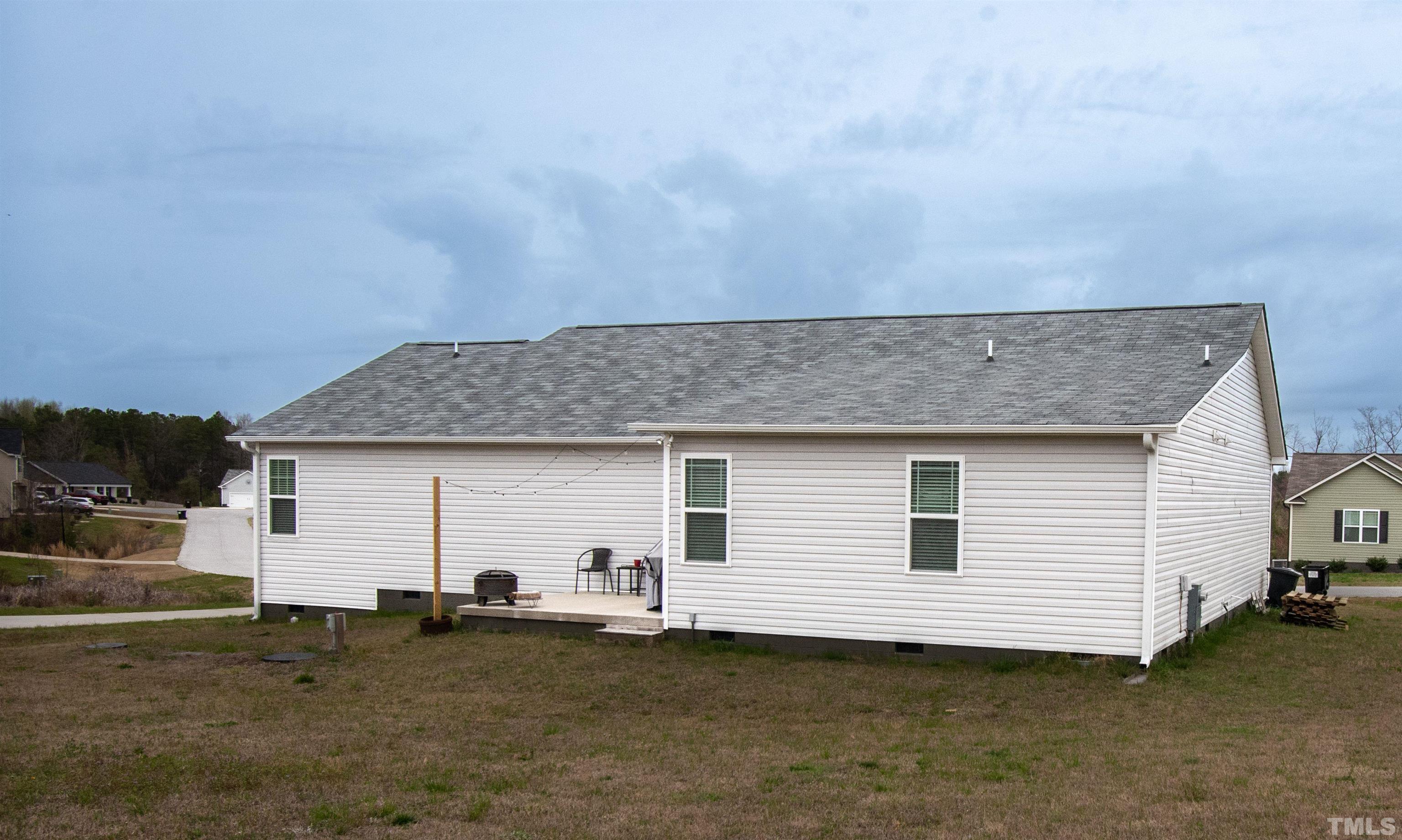 113 Cornfield Lane Benson, NC 27504 - Photo 2 of 13 a view of a house with backyard