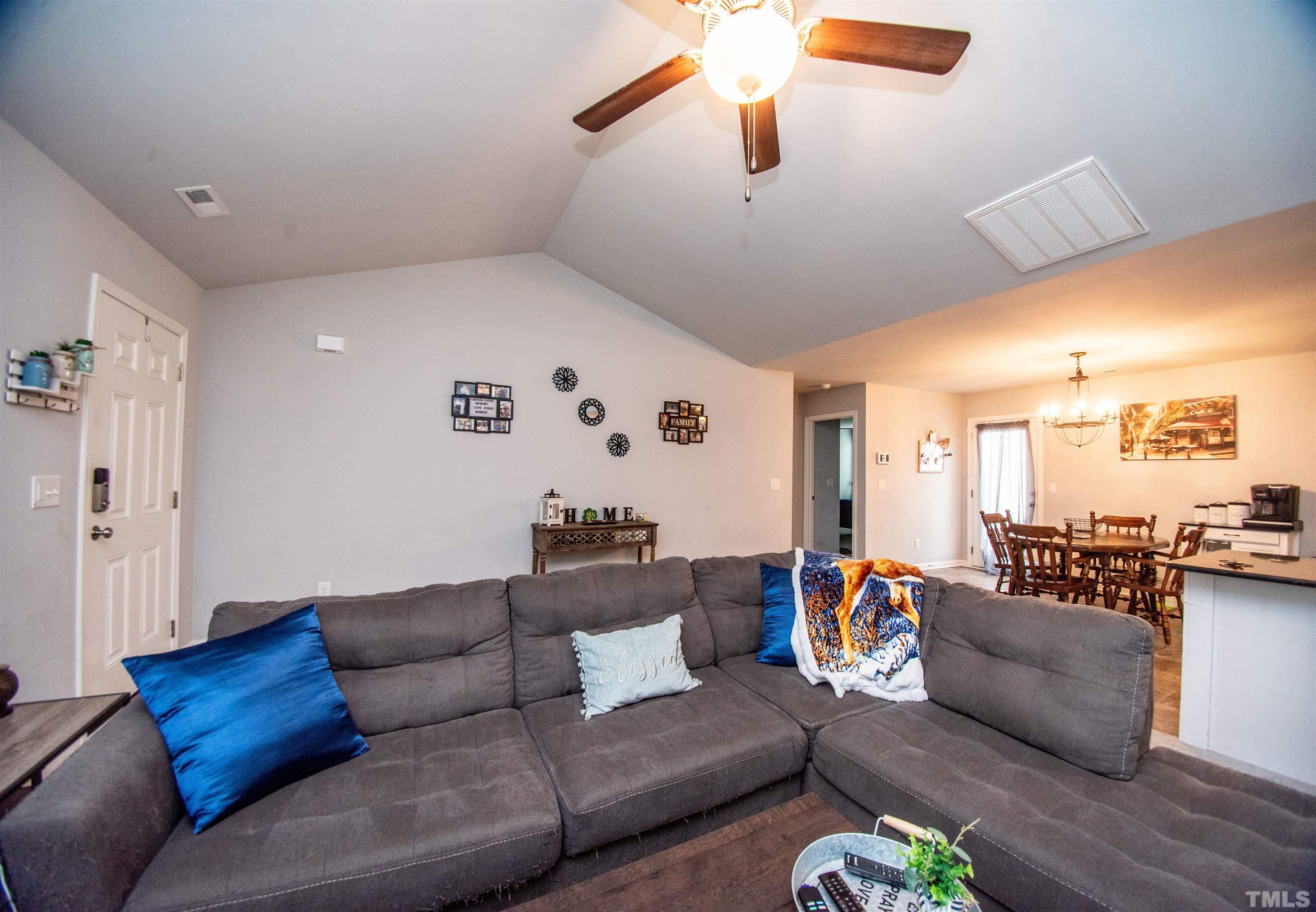 113 Cornfield Lane Benson, NC 27504 - Photo 5 of 13 a living room with furniture and a large window