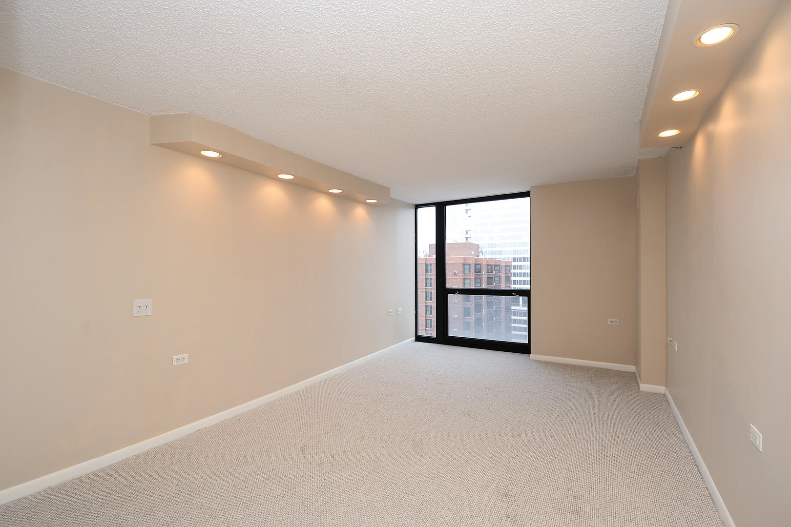 1122 North Clark Street, Unit 1203 Chicago, IL 60610 - Photo 12 of 22 a view of an empty room with a window