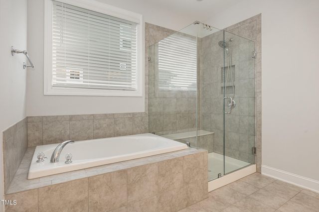 a bedroom with a bed and a table in it