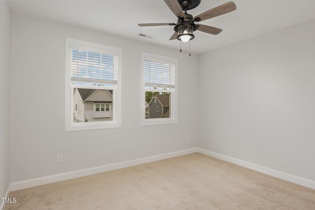 an empty room with a bathroom