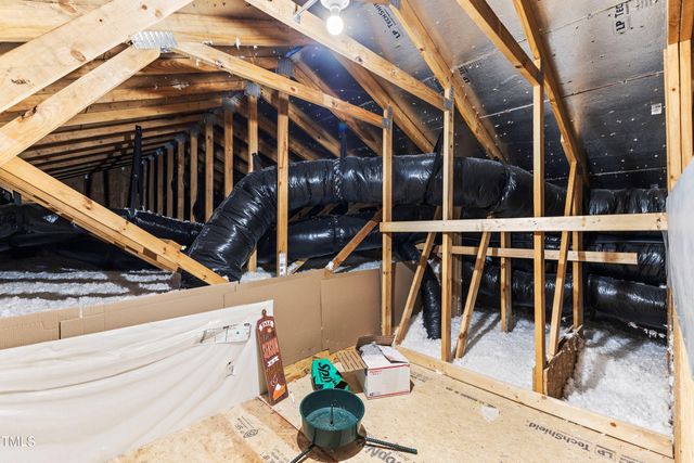 a view of a house with patio and a yard