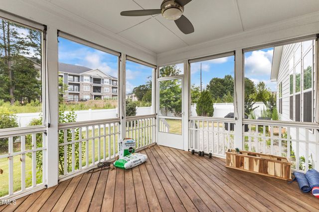 a view of a balcony with wooden floor