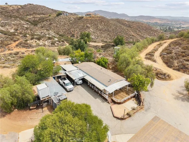 a view of a house with a backyard and balcony