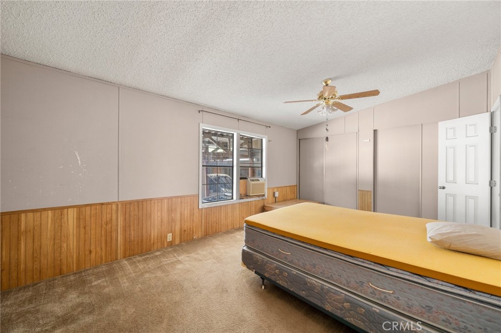 23900 Fellows Way Perris, CA 92570 - Photo 17 of 63 a bed sitting in a spacious bedroom next to a window