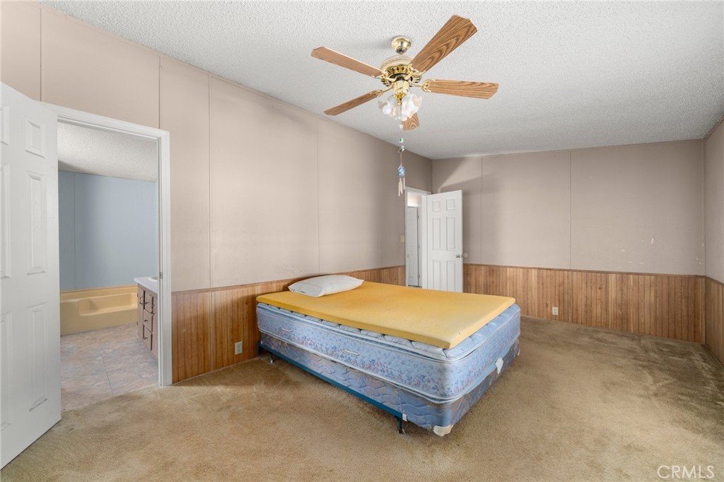 23900 Fellows Way Perris, CA 92570 - Photo 18 of 63 a blue bed sitting in a room