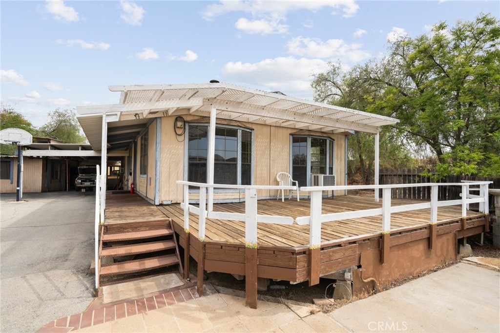 23900 Fellows Way Perris, CA 92570 - Photo 2 of 63 a view of a house with a backyard and balcony
