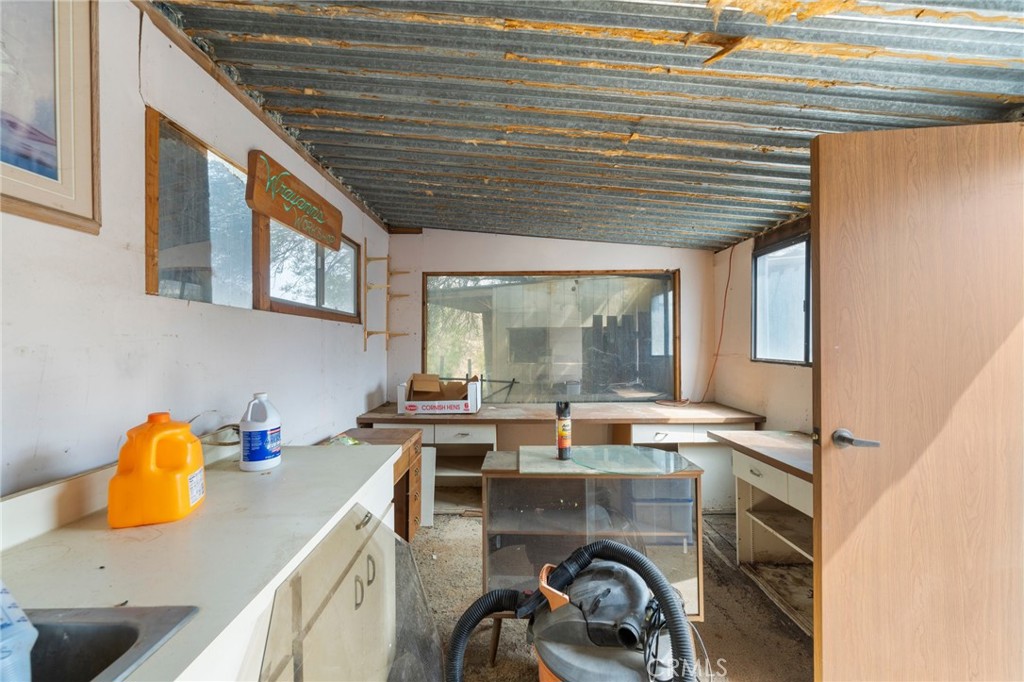 23900 Fellows Way Perris, CA 92570 - Photo 24 of 63 a room with stainless steel appliances granite countertop a sink and cabinets