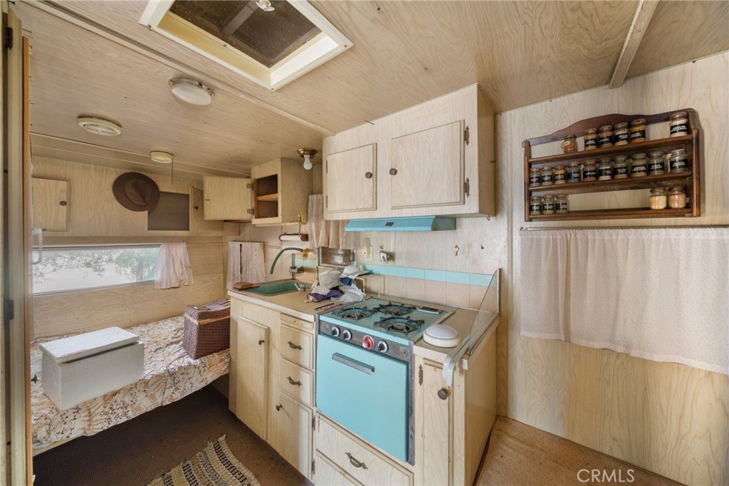 23900 Fellows Way Perris, CA 92570 - Photo 26 of 63 a kitchen with a stove and a microwave