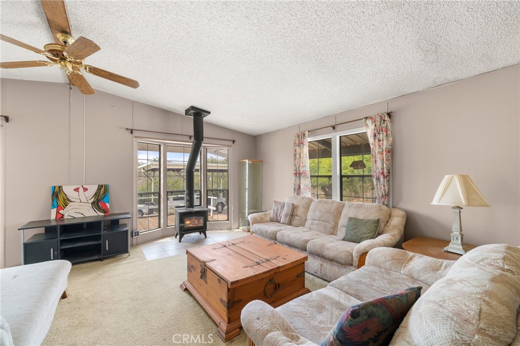 23900 Fellows Way Perris, CA 92570 - Photo 6 of 63 a living room with furniture and a large window
