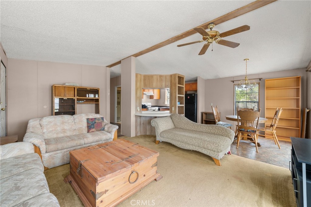 23900 Fellows Way Perris, CA 92570 - Photo 7 of 63 a living room with furniture and a large mirror