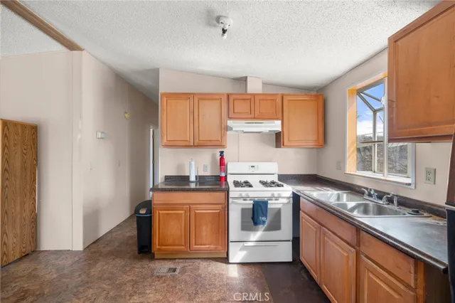 a bathroom with a sink toilet tub and shower
