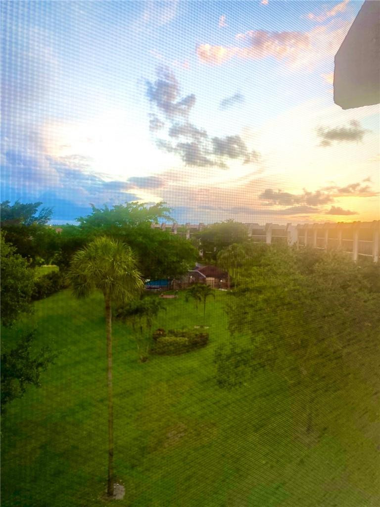 9170 Southwest 14th Street, Unit 4504 Boca Raton, FL 33428 - Photo 13 of 14 Sunset View from Patio