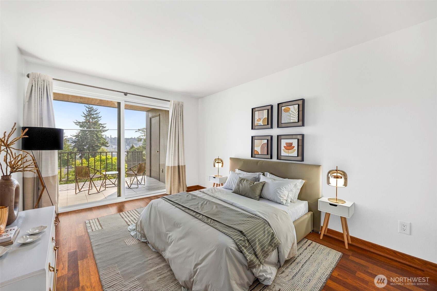 3601 24th Avenue West, Unit 207 Seattle, WA 98199 - Photo 13 of 24 a bedroom with a large bed and a large window