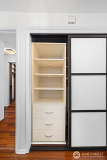 a view of walk in closet with empty racks
