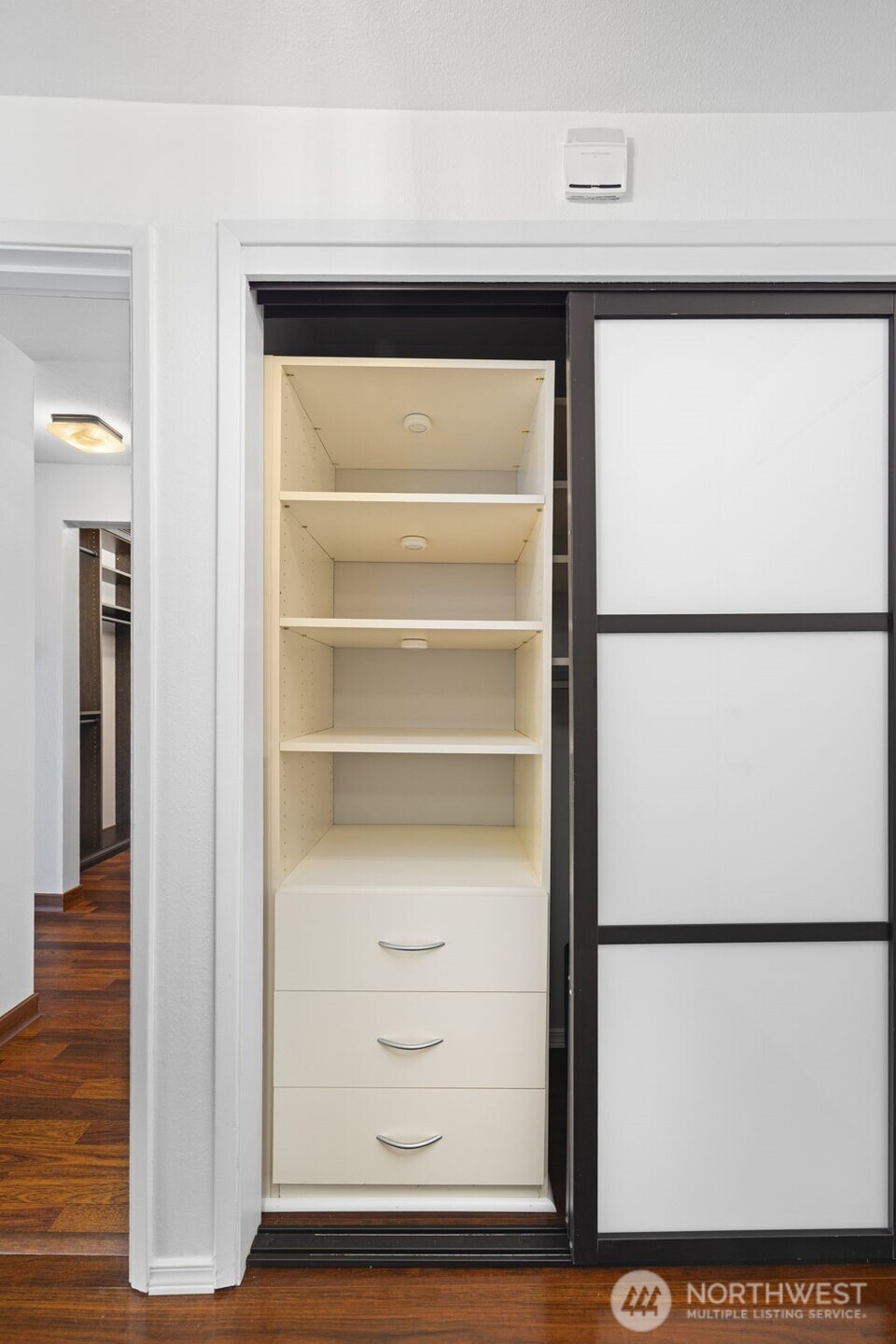 3601 24th Avenue West, Unit 207 Seattle, WA 98199 - Photo 17 of 24 a view of walk in closet with empty racks