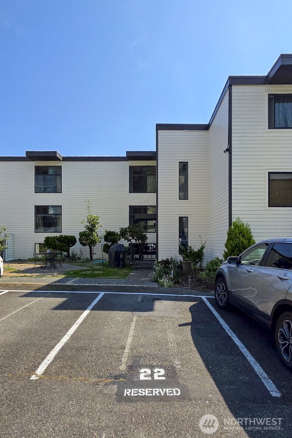 3601 24th Avenue West, Unit 207 Seattle, WA 98199 - Photo 18 of 24 a house view with a garden space