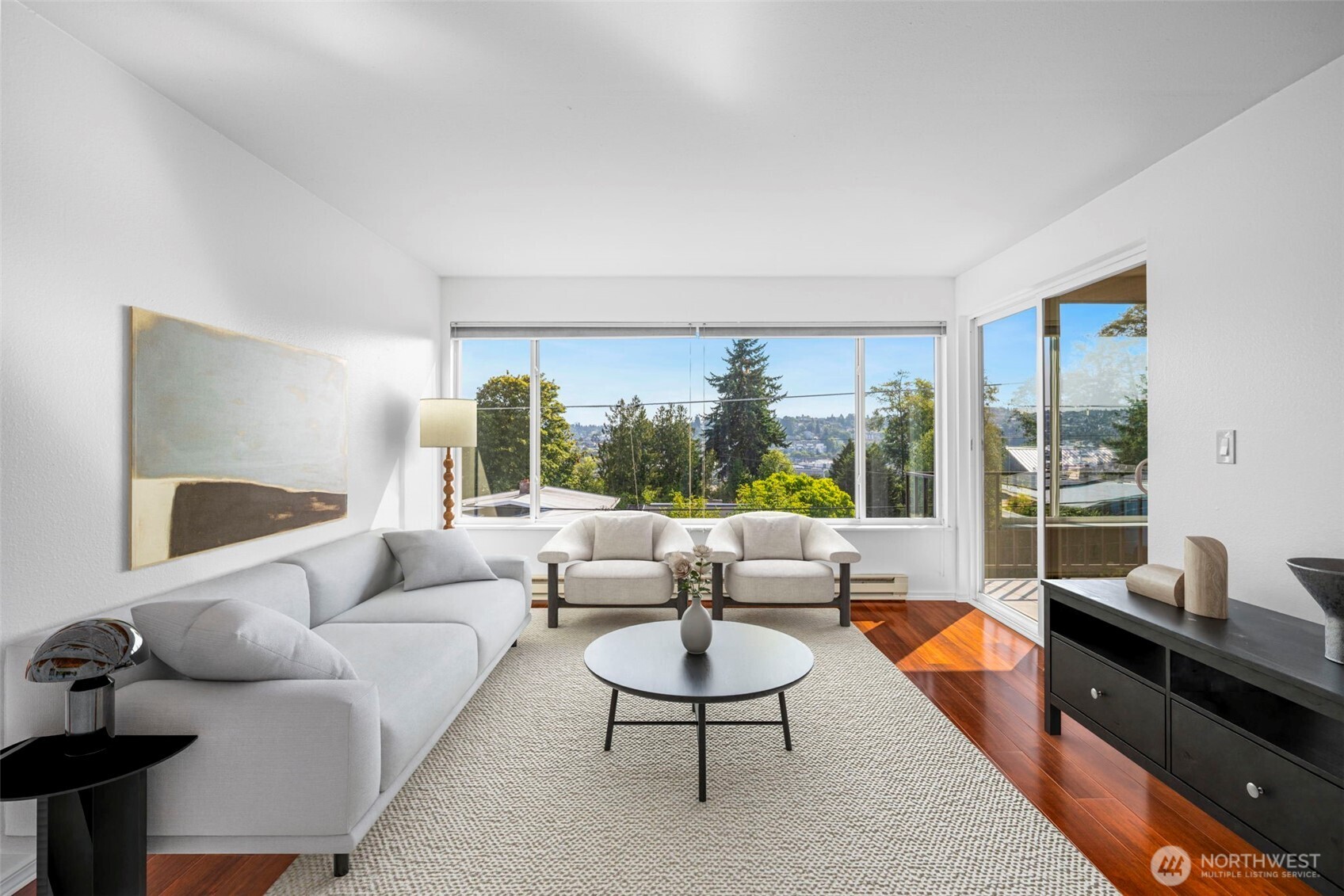 3601 24th Avenue West, Unit 207 Seattle, WA 98199 - Photo 4 of 24 a living room with furniture and a large window