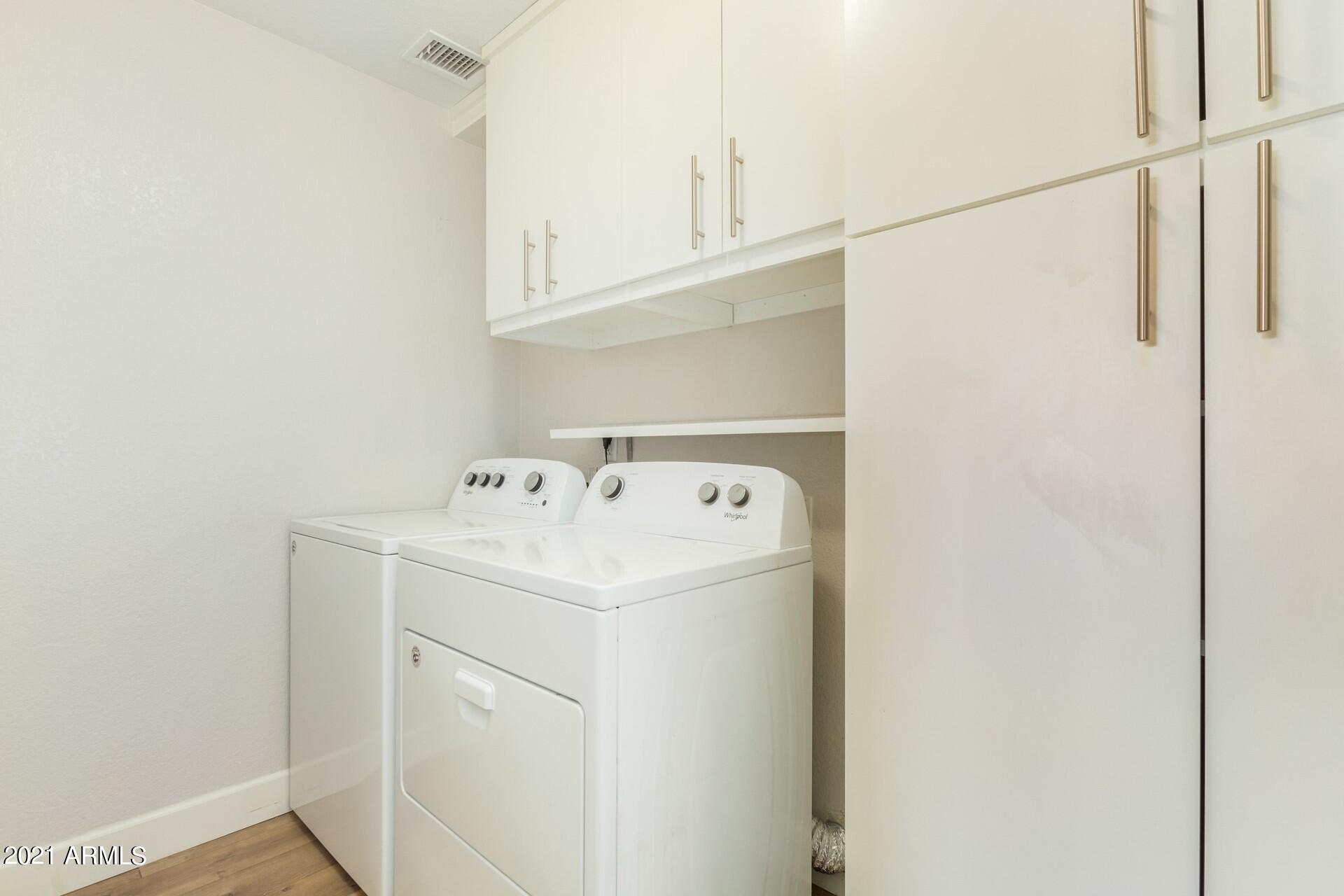 2018 East Wagoner Road Phoenix, AZ 85022 - Photo 17 of 23 LAUNDRY ROOM WITH BUILT IN CABINETS
