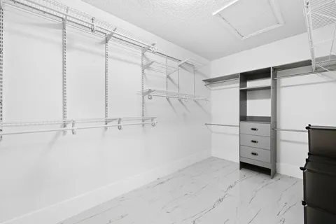 a spacious bathroom with a double vanity sink and a mirror