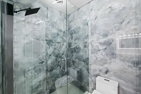 a bathroom with a sink vanity and a mirror