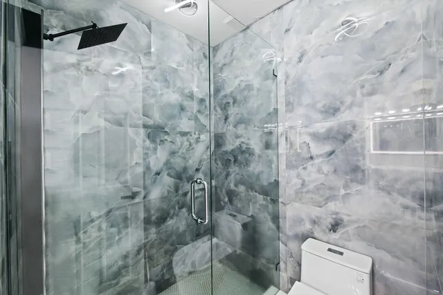 a bathroom with a sink vanity and a mirror