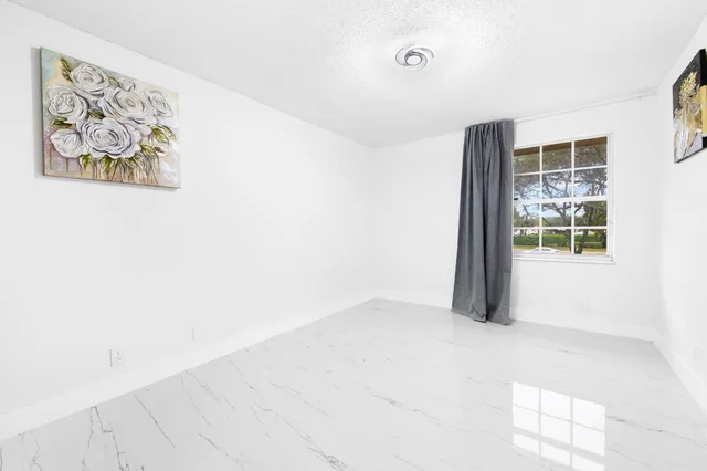 a view of a livingroom with wooden floor
