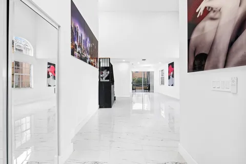 a view of entryway and kitchen