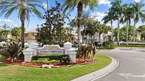 a view of a house with a yard patio and swimming pool