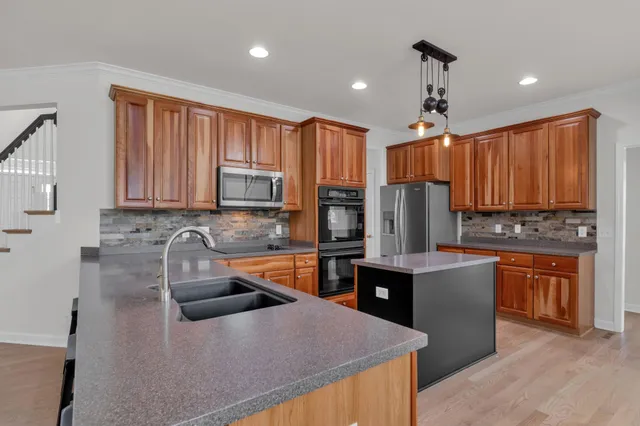 a spacious bedroom with a bed and a large window
