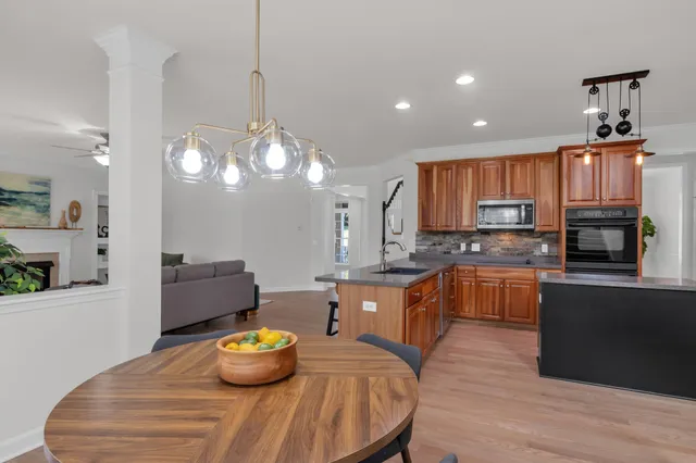 a view of a kitchen with white cabinets