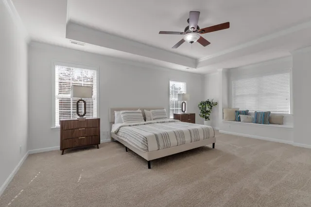an empty room with a ceiling fan and a fan