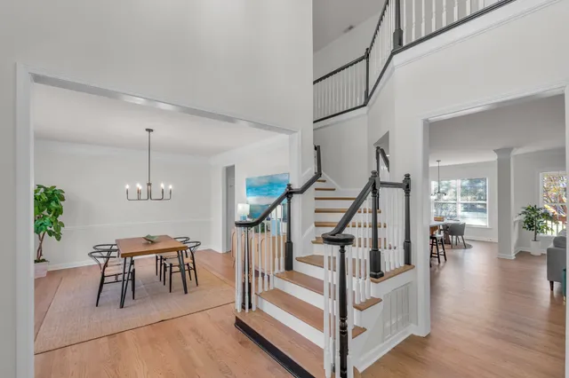 a living room with furniture potted plant and a window