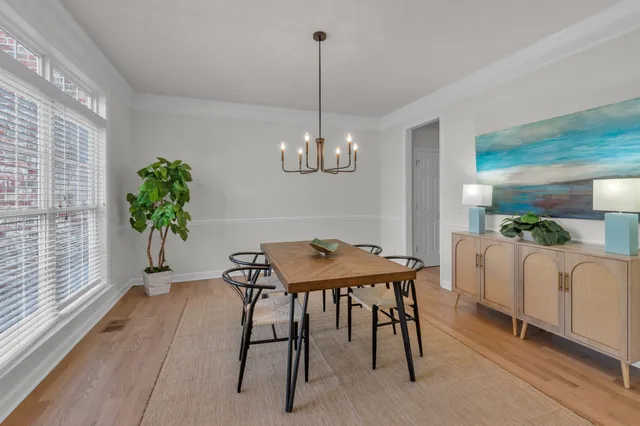 a large kitchen with a table and chairs
