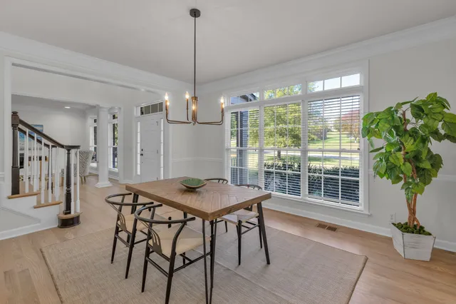 a kitchen with stainless steel appliances a sink a stove a refrigerator cabinets and a counter top space