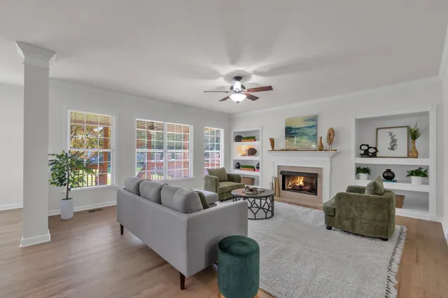a kitchen with a refrigerator and a stove top oven