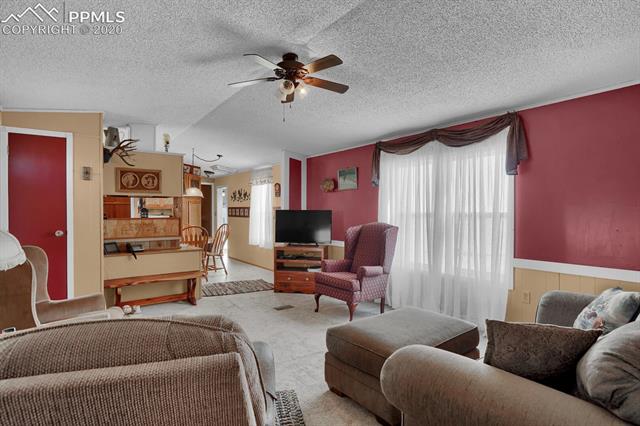 4685 South Yoder Road Yoder, CO 80864 - Photo 9 of 32 Cooling provided by a swamp cooler as well as a central ceiling fan.