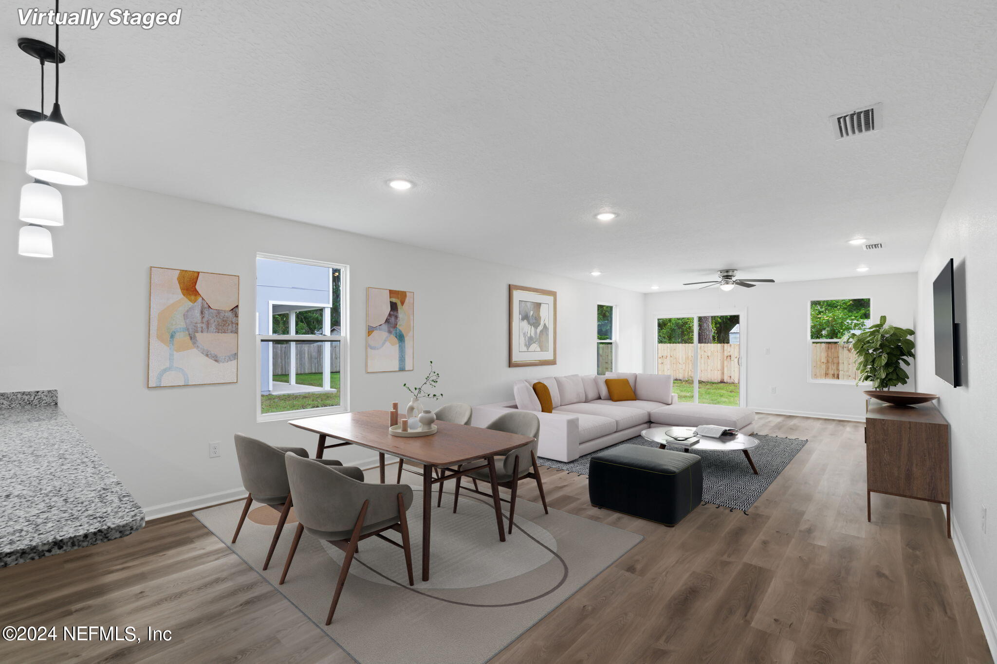 1014 Floyd Street Fleming Island, FL 32003 - Photo 18 of 48 a living room with furniture wooden floor and a table