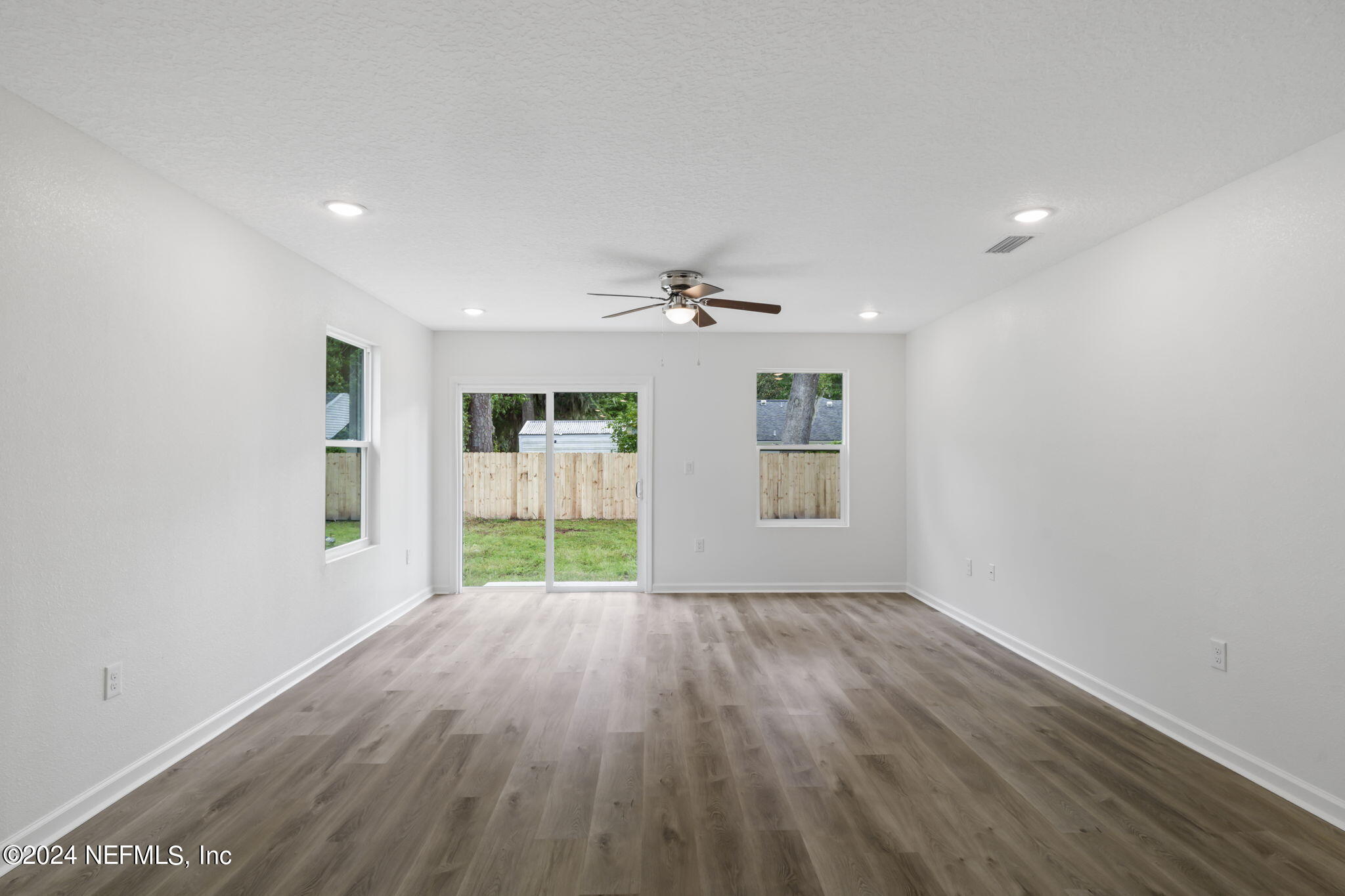 1014 Floyd Street Fleming Island, FL 32003 - Photo 19 of 48 wooden floor in an empty room with a window